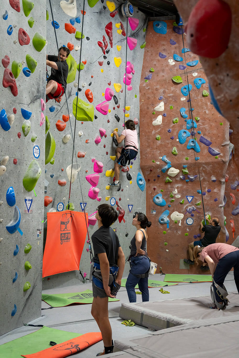 rock-climbers on auto belays at NJ Rock Gym.